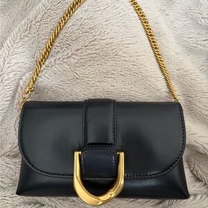 Elegant Black Leather Bag with Gold Chain